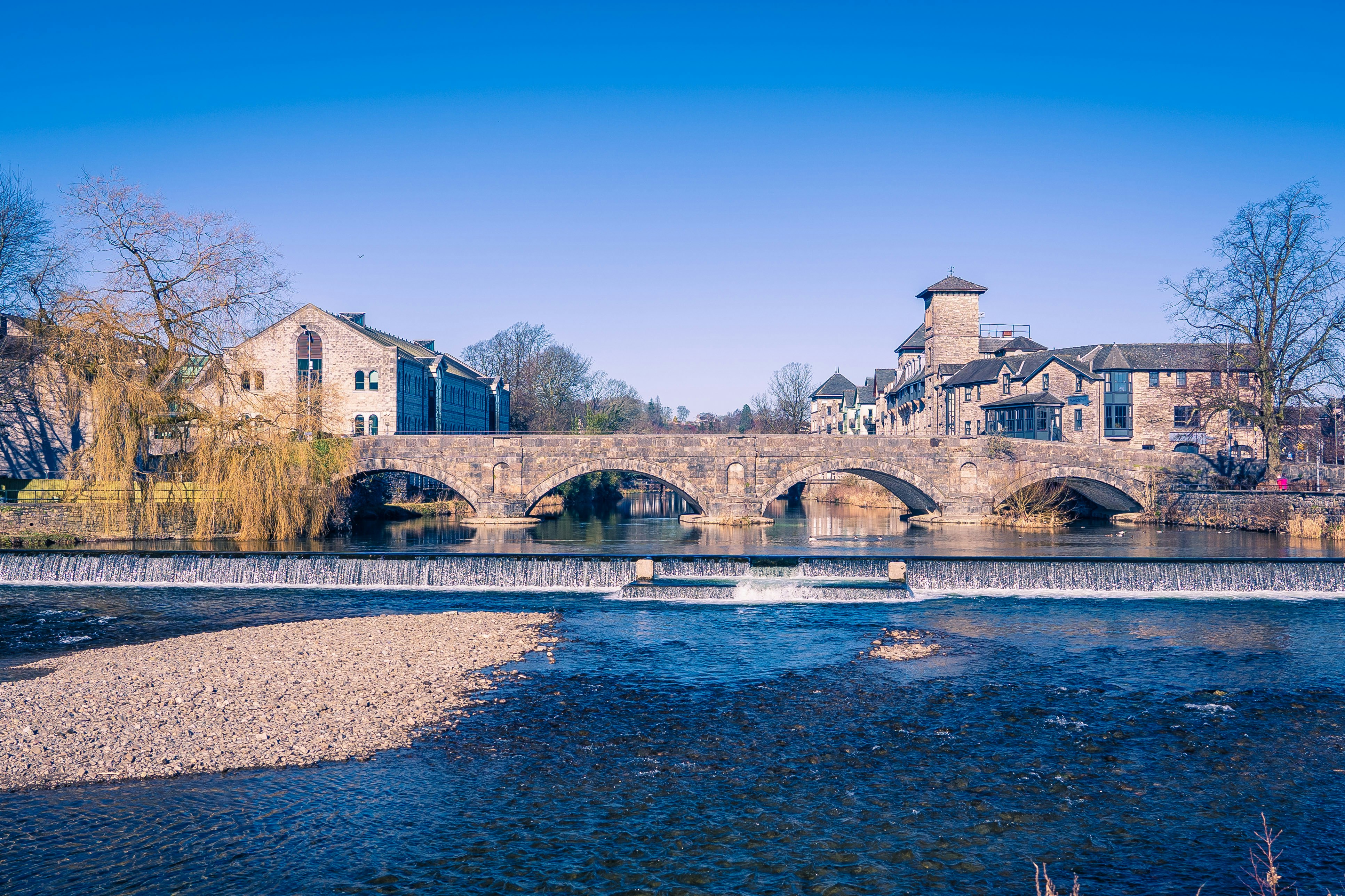 brown concrete bridge over river